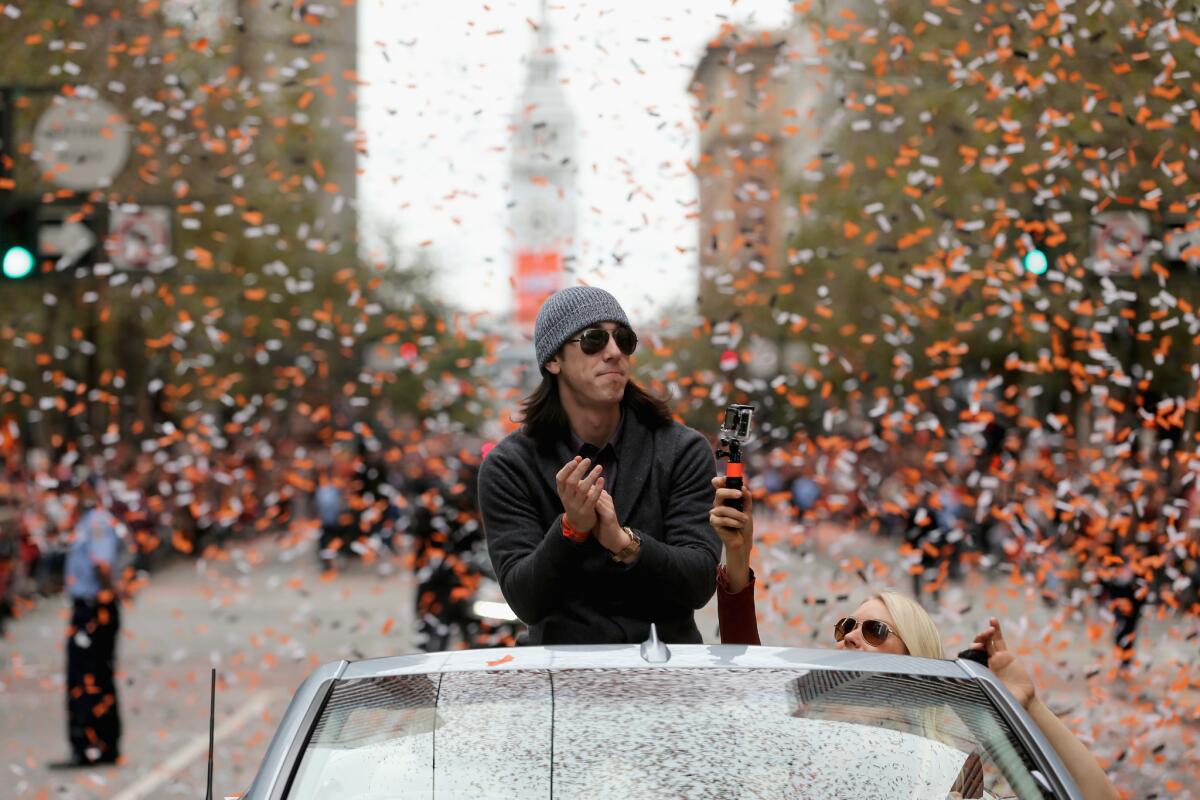 Tim Lincecum basks in the cheers of the crowd during the 2012 victory parade for the San Francisco Giants.