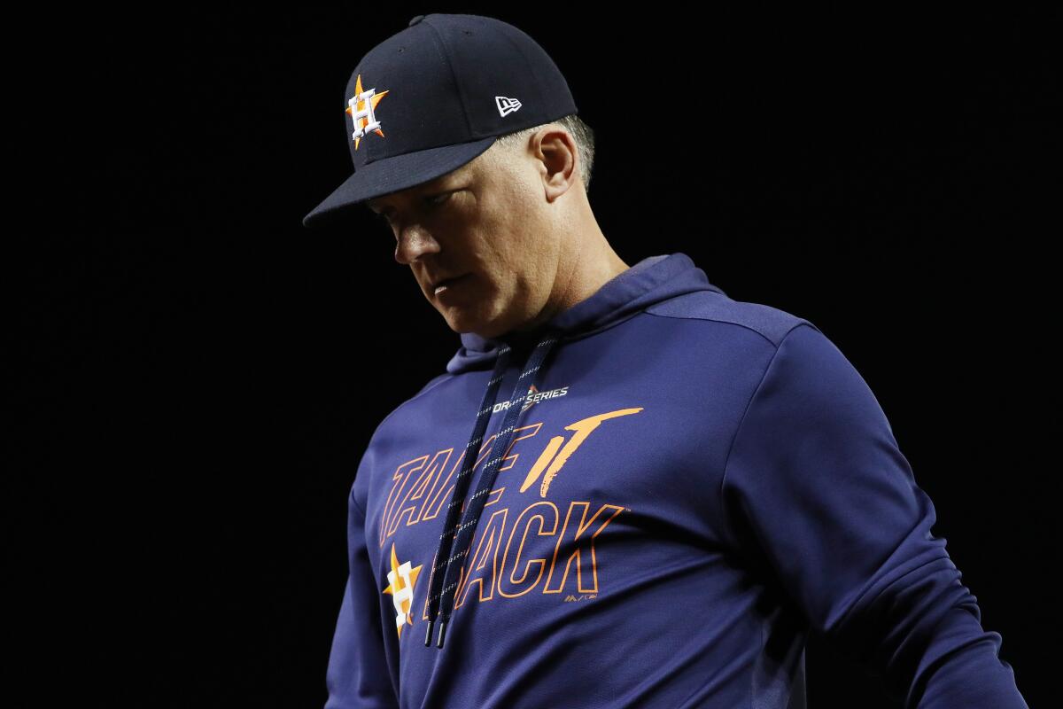 WASHINGTON, DC - OCTOBER 27: AJ Hinch #14 of the Houston Astros returns to the dugout after a mound visit against the Washington Nationals during the seventh inning in Game Five of the 2019 World Series at Nationals Park on October 27, 2019 in Washington, DC. (Photo by Patrick Smith/Getty Images) ** OUTS - ELSENT, FPG, CM - OUTS * NM, PH, VA if sourced by CT, LA or MoD **