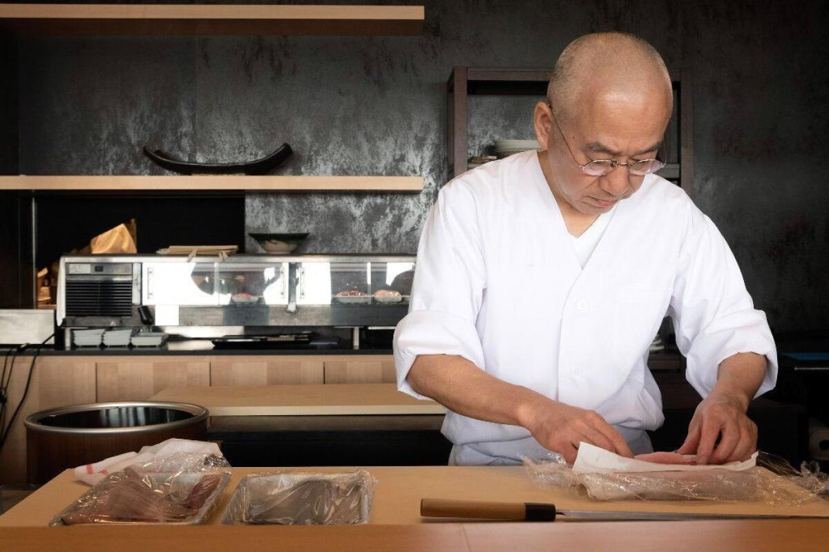 Onodera preps fish at Inn Ann's sushi bar