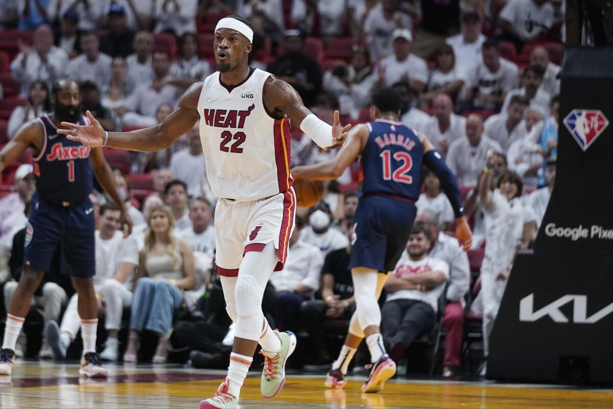 Heat forward Jimmy Butler celebrates after scoring against the 76ers.