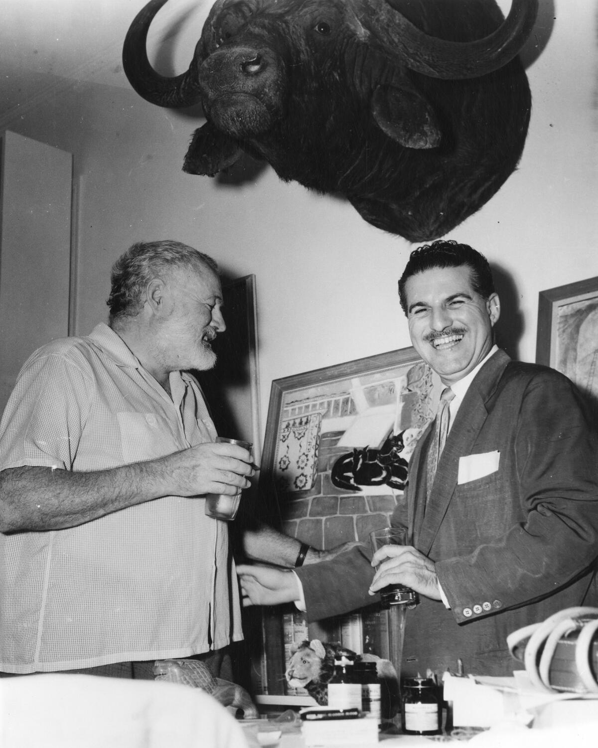 Ernest Hemingway, left, and Cuban journalist Fernando Campoamor.