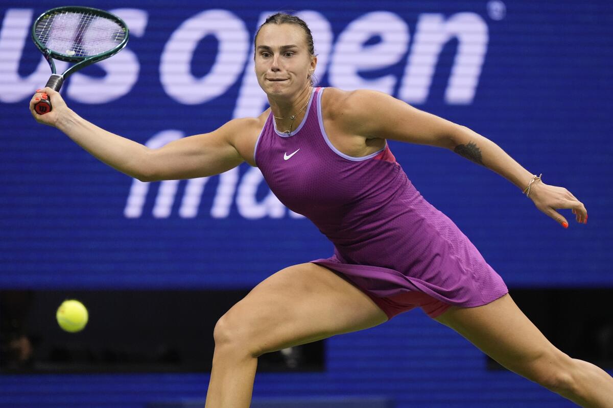 Aryna Sabalenka hits a return during her championship victory over Jessica Pegula.