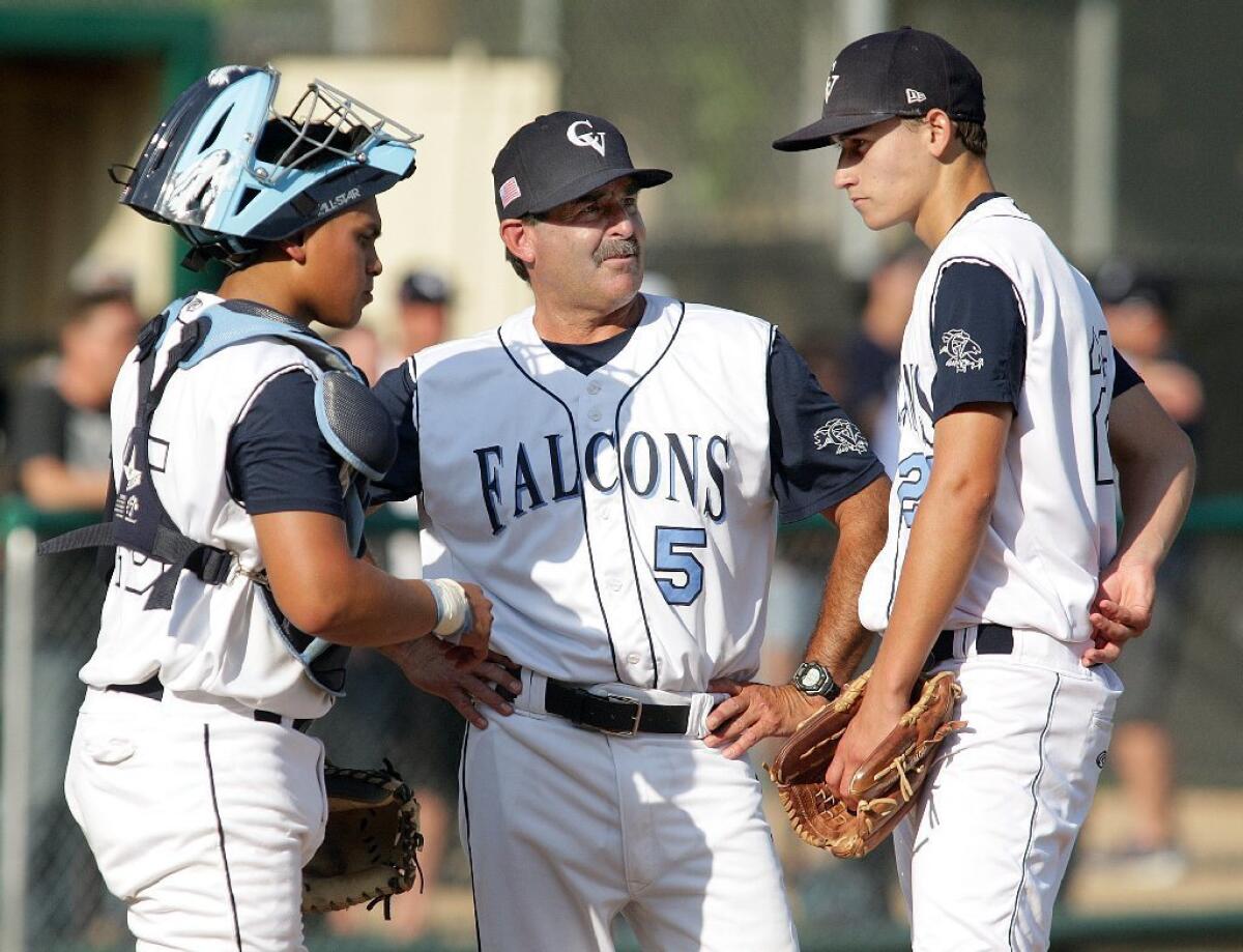 Kewin Ledesma, left, and Trevor Beer, right, return to lead coach Phil Torres', center, Crescenta Valley High baseball team in 2017.