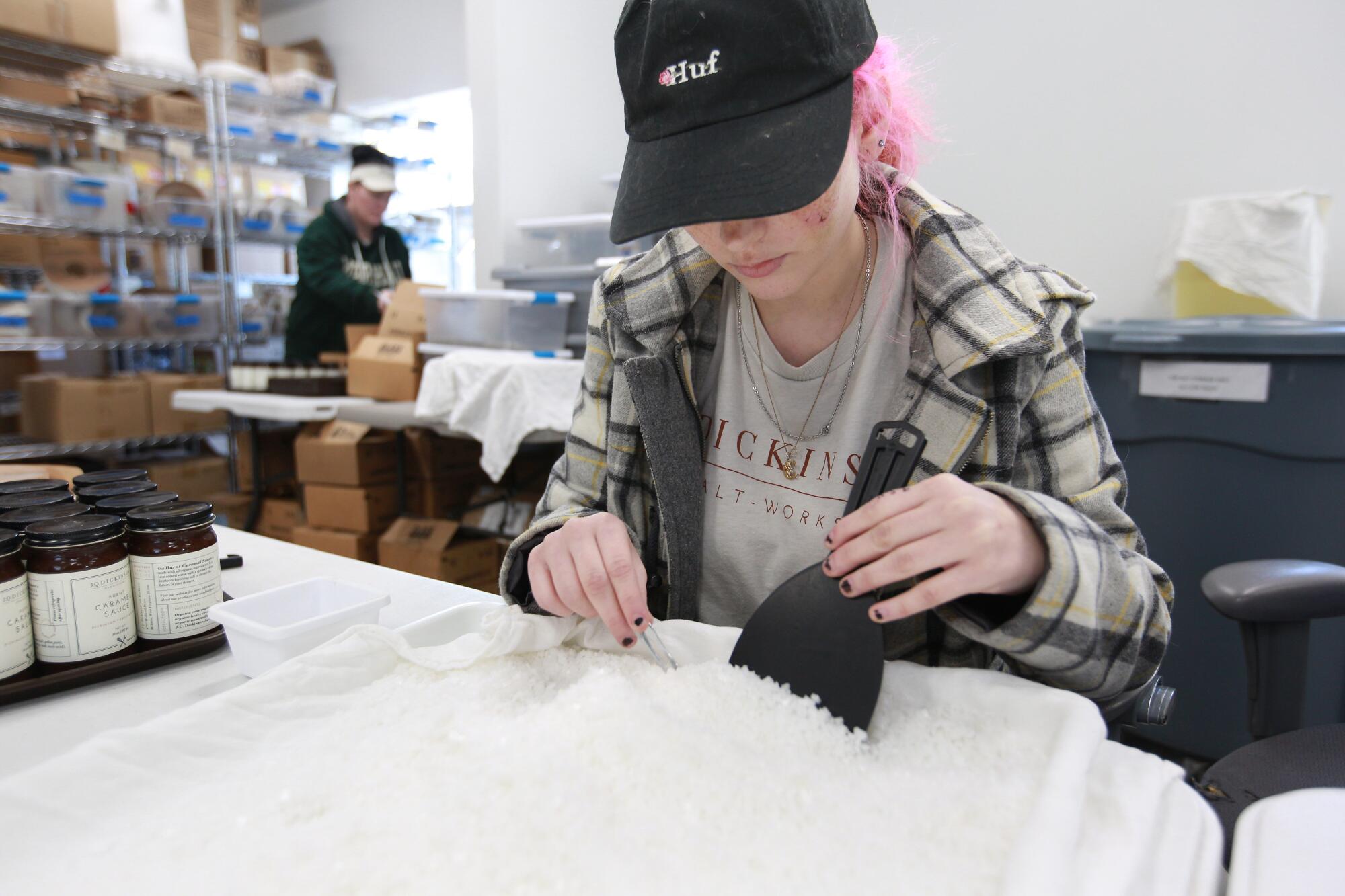 A J.Q. Dickinson worker goes through the salt by hand to pick out impurities.