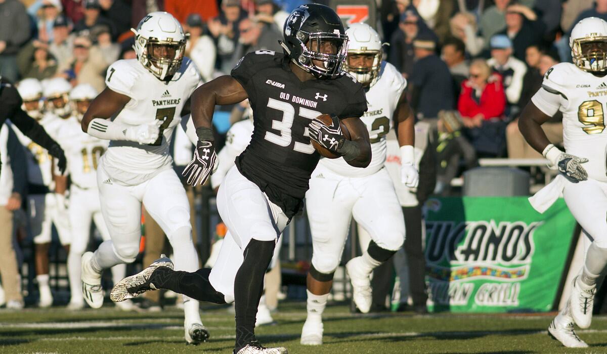 Old Dominion's Ray Lawry runs for a touchdown in the first half against Florida International on Nov. 26. Lawry ran for 133 yards against Eastern Michigan in the Bahamas Bowl.