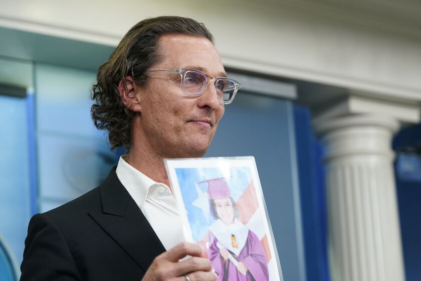 Actor Matthew McConaughey holds an image of Alithia Ramirez, 10, who was killed in the mass shooting at an elementary school in Uvalde, Texas, as he speaks during a press briefing at the White House, Tuesday, June 7, 2022, in Washington. (AP Photo/Susan Walsh)