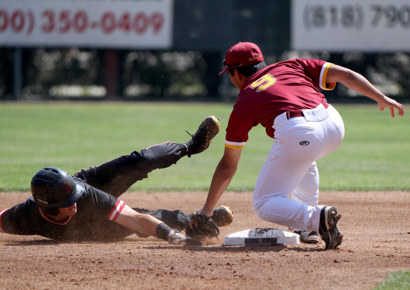 Glendale Community College baseball shortstop Lucas Sakay gets the out as #3 Nicholas Prainito sides past second base in home game vs. Santa Barbara City College, in game one of round one of the California Community College Athletic Association Southern California Baseball Regional Championships at Stengel Field in Glendale on Friday, May 3, 2019.