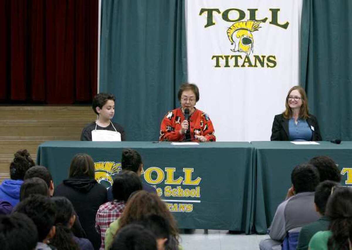 Kid's Resource founder Gerry Orz, 10, left, State Sen. Carol Liu, center, and Peace Over Violence's Emily Austin, right, celebrated California Bullying Prevention Day at Toll Middle School. Orz, who was bullied in elementary school, did not speak but played a recording of his voice encouraging everyone to play a role in stopping bullying.