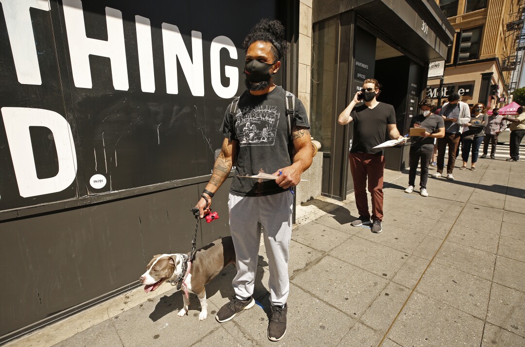 Steven White, 28, with his dog "Doja."