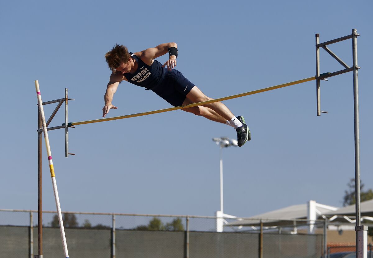 Newport Harbor's Leo Davis clears a height of 13 feet, 6 inches in the boys' pole vault.