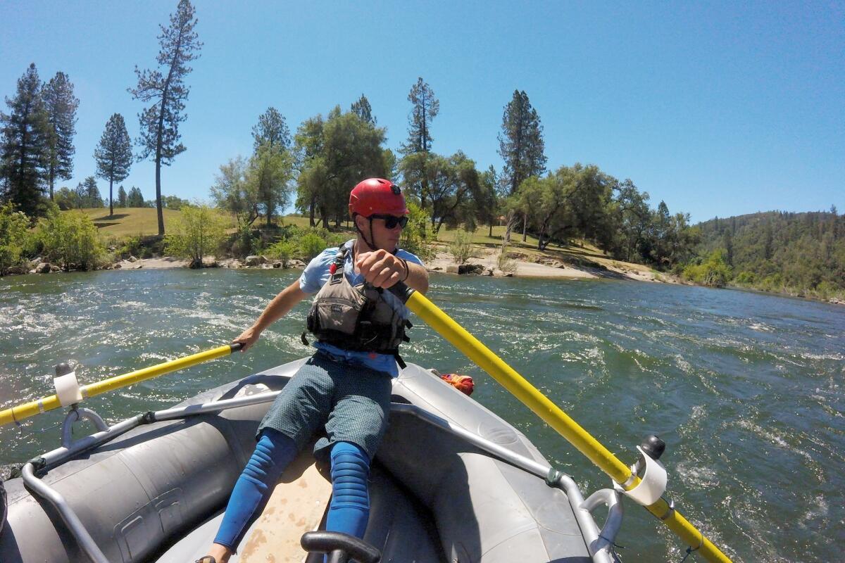 Guide Kyle Brazil navigates the South Fork of the American River near Coloma, Calif.. (Christopher Reynolds/Los Angeles Times)