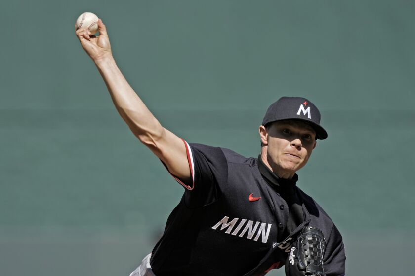 Minnesota Twins starting pitcher Sonny Gray throws during the first inning of a baseball game against the Kansas City Royals Saturday, April 1, 2023, in Kansas City, Mo. (AP Photo/Charlie Riedel)