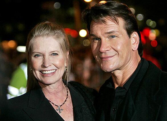 Patrick Swayze, accompanied by his wife, Lisa Niemi, pose prior to the premiere of his film "Keeping Mum" in 2005 in central London.