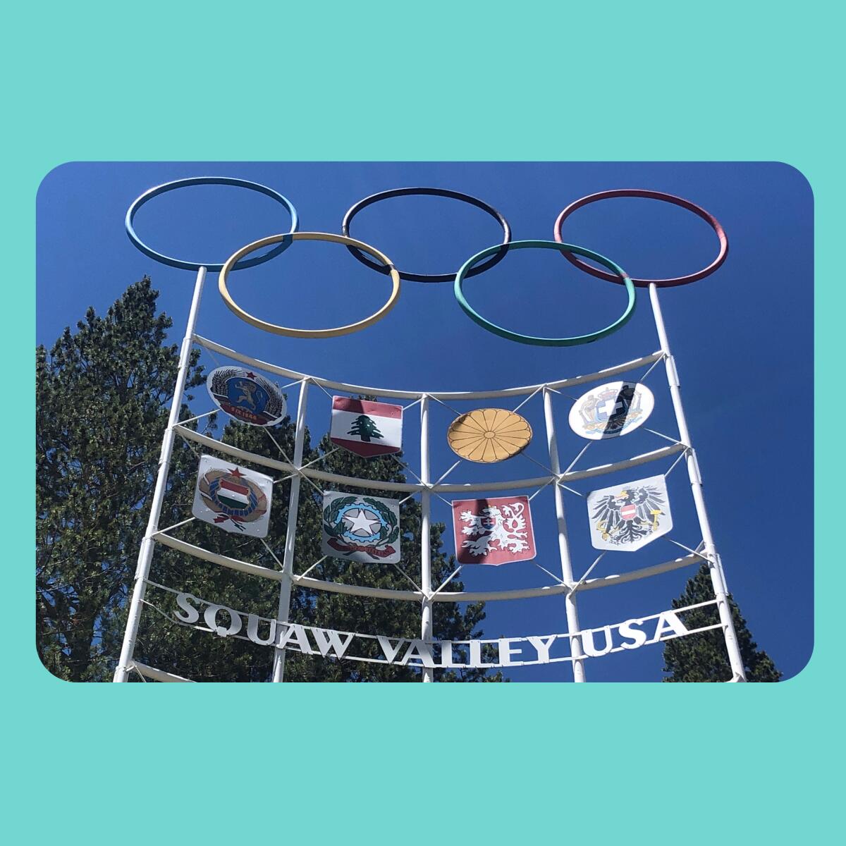 The Olympic rings stand at the entrance to a ski resort