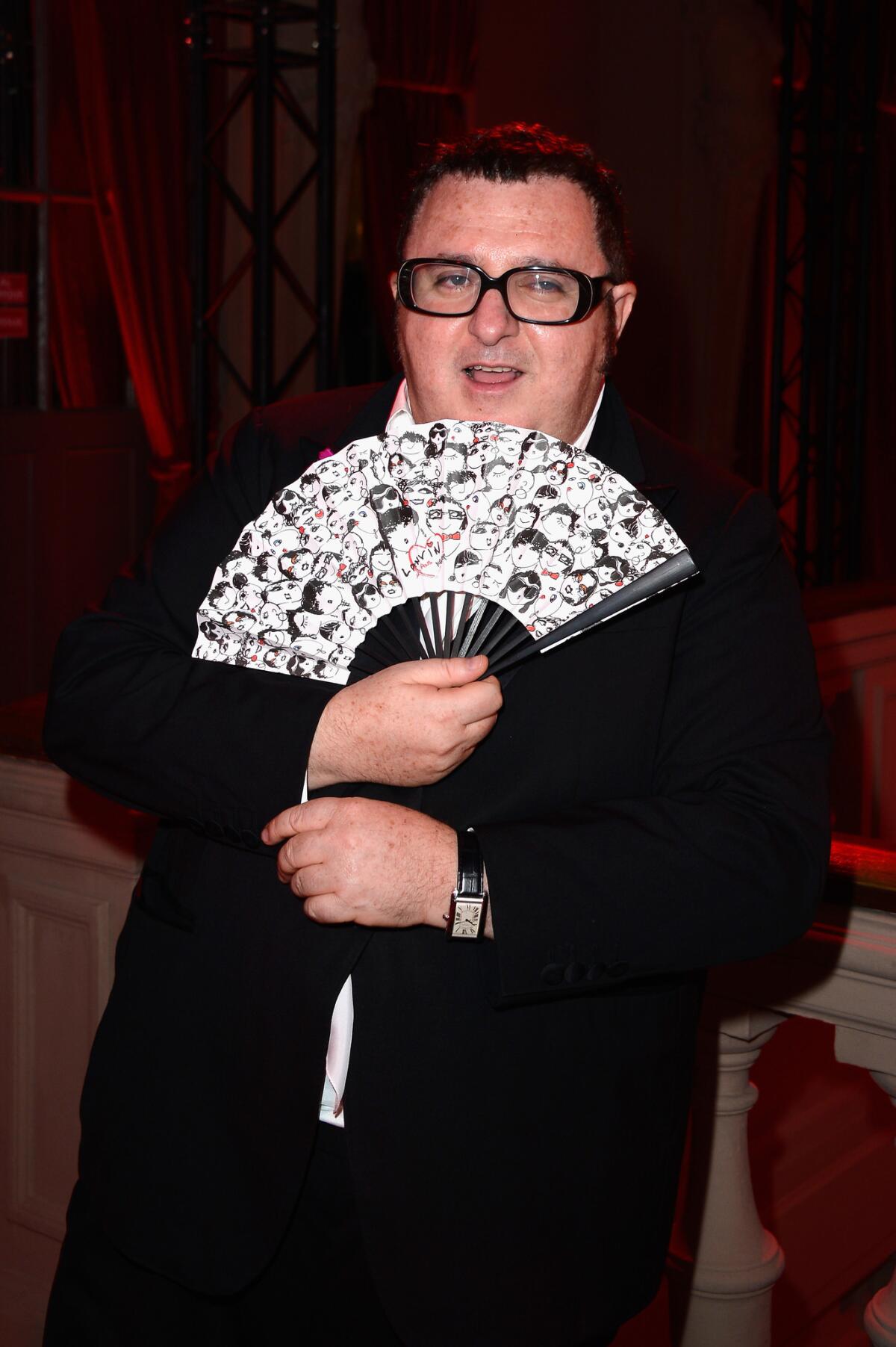 Alber Elbaz relaxes at the "Lancome Show By Alber Elbaz" party at Le Trianon on Tuesday in Paris.