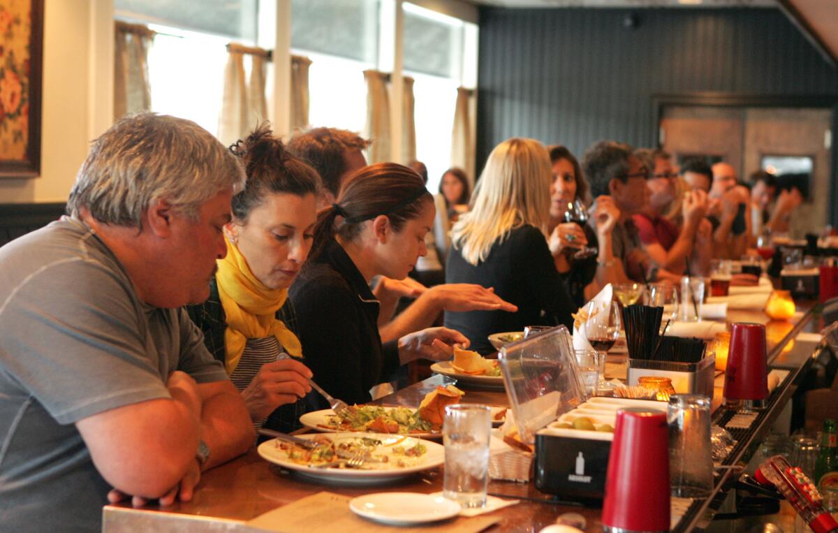 The bar area at Waterloo & City is packed for happy hour. But this Wednesday chef Brendan Collins is cooking a 6-course dinner featuring a Gloucester Old Spot pig and the wines of Tablas Creek Vineyard.