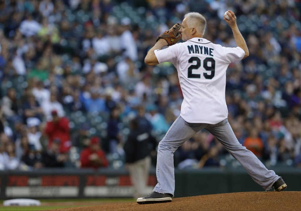 Kenny Mayne throws out the first pitch before a game between the Seattle Mariners and the Angels in September 2014.