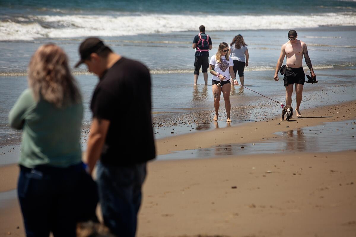 People enjoy a day at the beach after Ventura County modified its coronavirus stay-at-home order to permit some businesses to reopen and some activities and gatherings at Port Hueneme Beach Park.