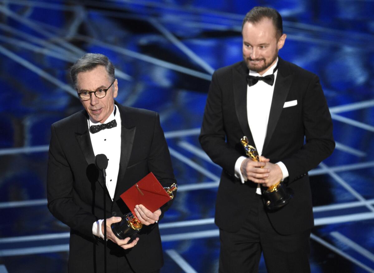 Kevin O'Connell, speaking, and Andy Wright accept their Oscars.