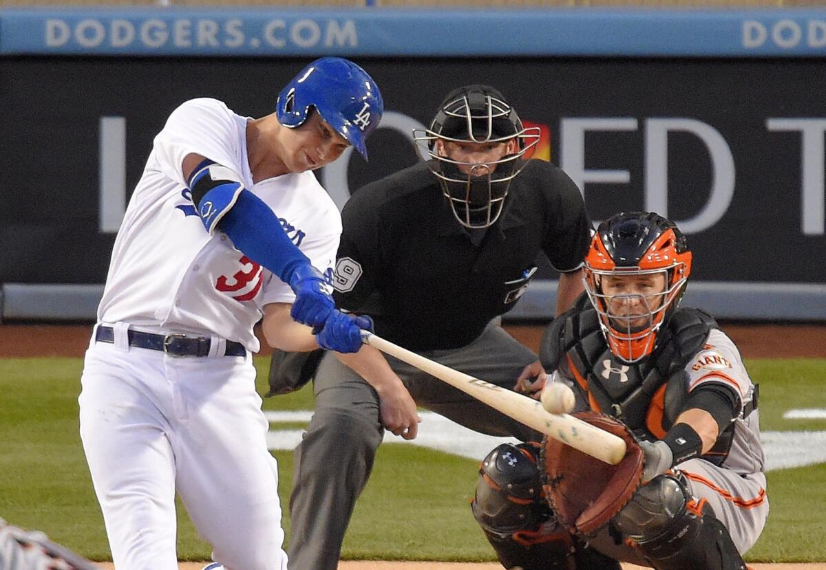 Dodgers center fielder Joc Pederson connects for a home run against the Giants in the bottom of the first inning Wednesday night.