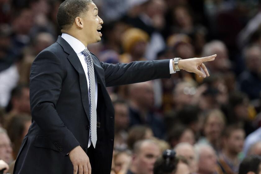 Cavaliers Coach Tyronn Lue yells to players in the second half of Cleveland's 114-107 win over the Timberwolves.