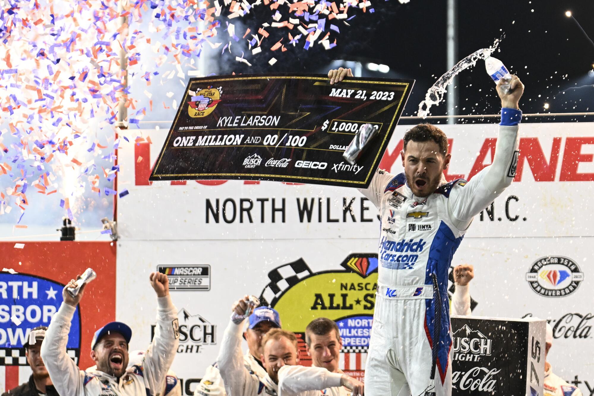 NASCAR driver Kyle Larson celebrates in Victory Lane after winning the All-Star Cup race at North Wilkesboro Speedway.