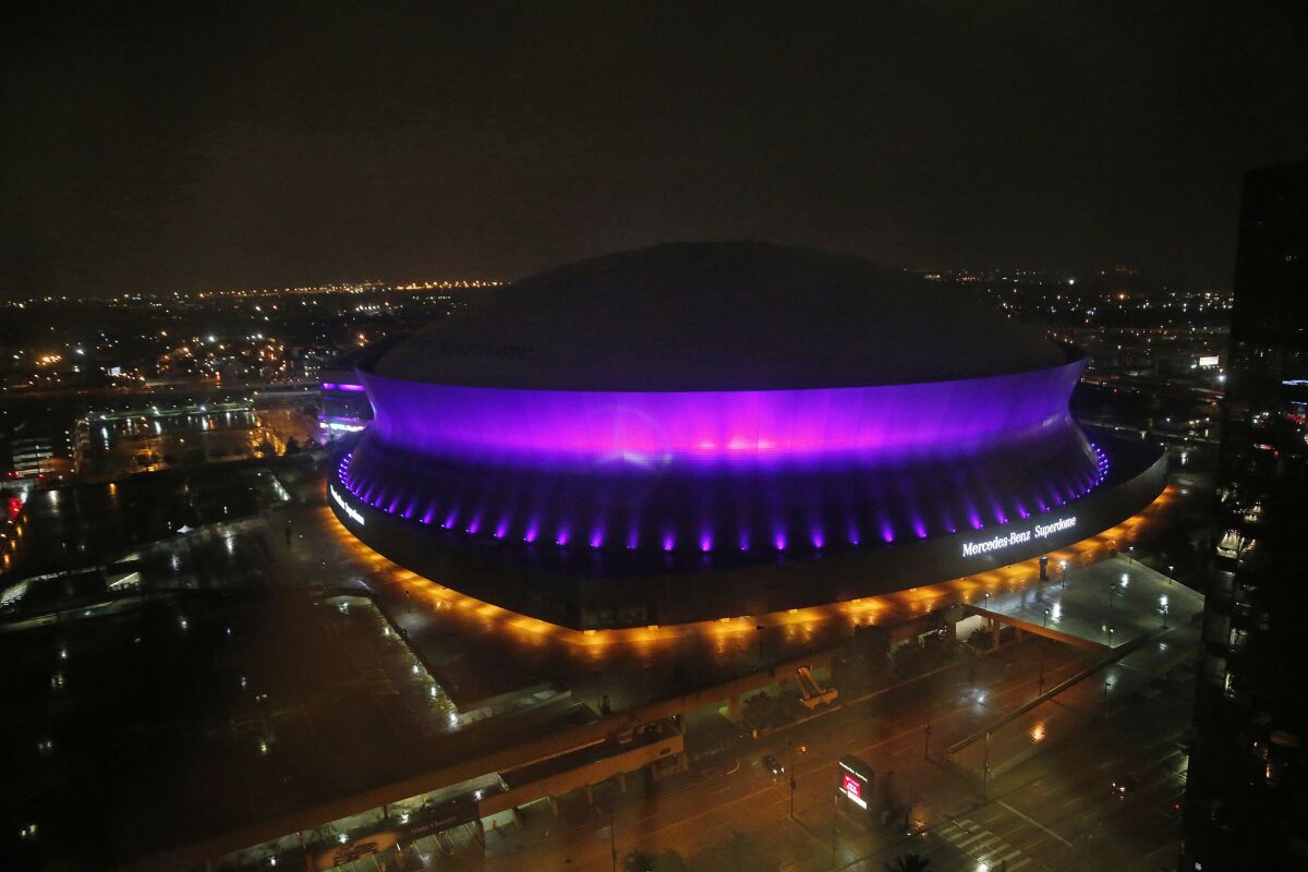 The Mercedes-Benz Superdome in New Orleans was among buildings around the country and beyond that were lit up in purple.