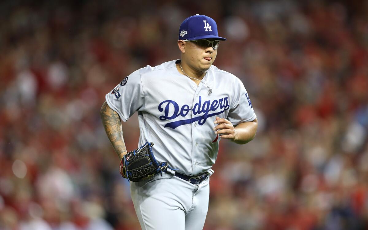 Dodgers pitcher Julio Urias jogs off the mound during Game 4 of the National League Division Series against the Washington Nationals on Oct. 7.
