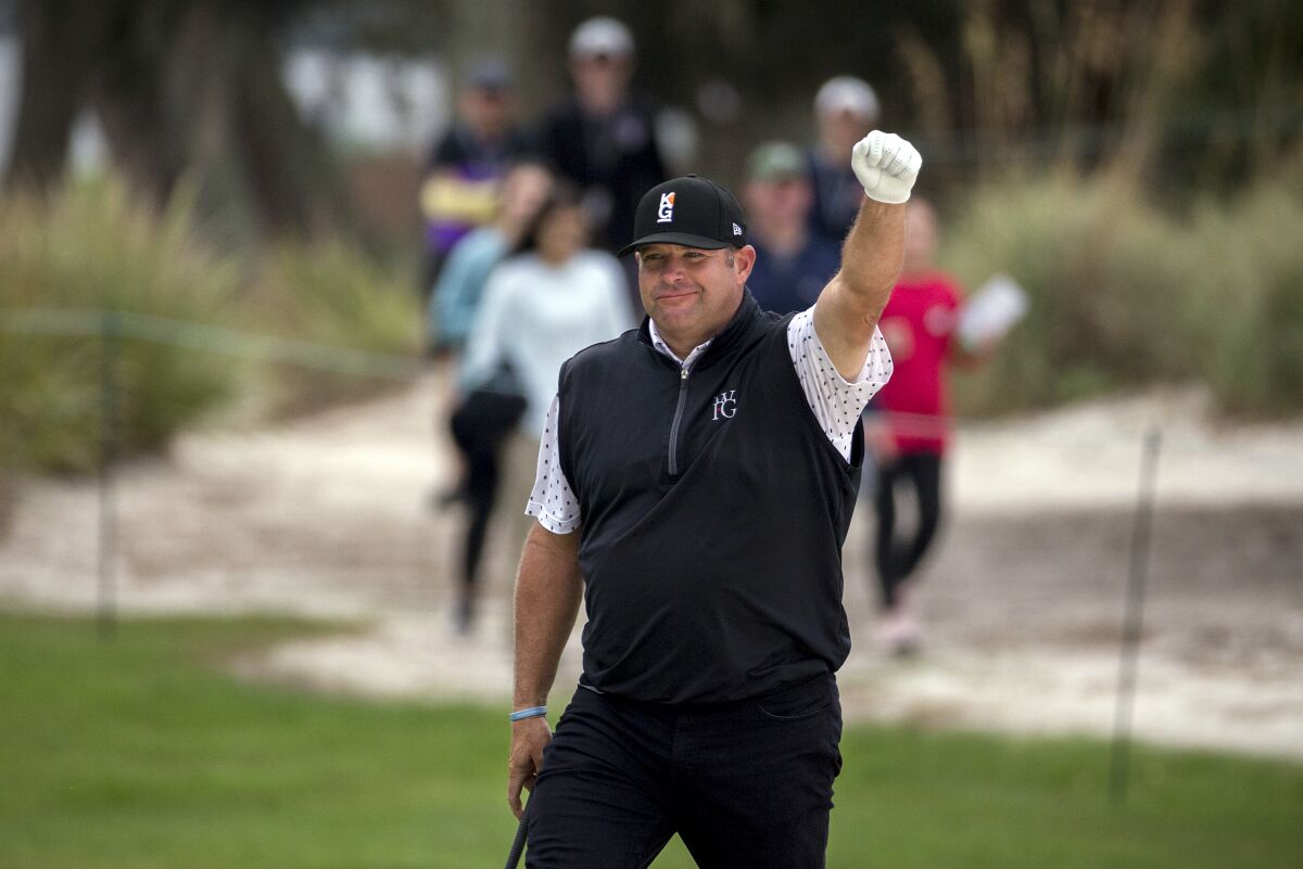 FILE - Jason Gore celebrates after hitting a birdie chip shot on the first green during the final round of the RSM Classic golf tournament on Nov. 18, 2018, in St. Simons Island, Ga. The tour announced Friday, Aug. 19, 2022, that it has hired Gore as a player advisor to the commissioner. (AP Photo/Stephen B. Morton, File)