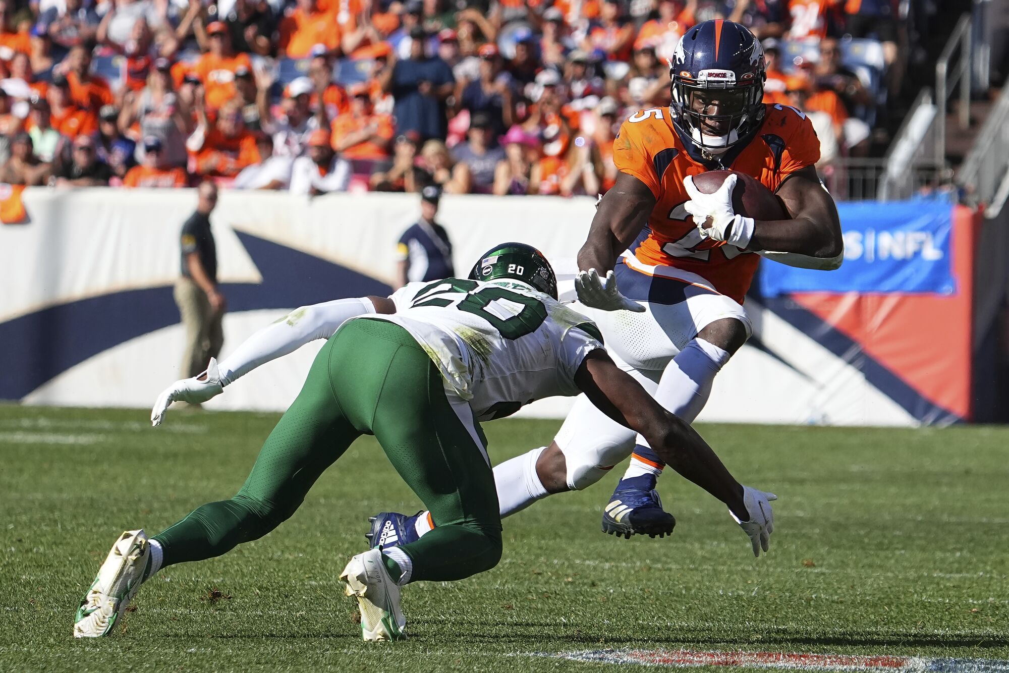 Denver Broncos' Melvin Gordon III runs down the field against the New York Jets.