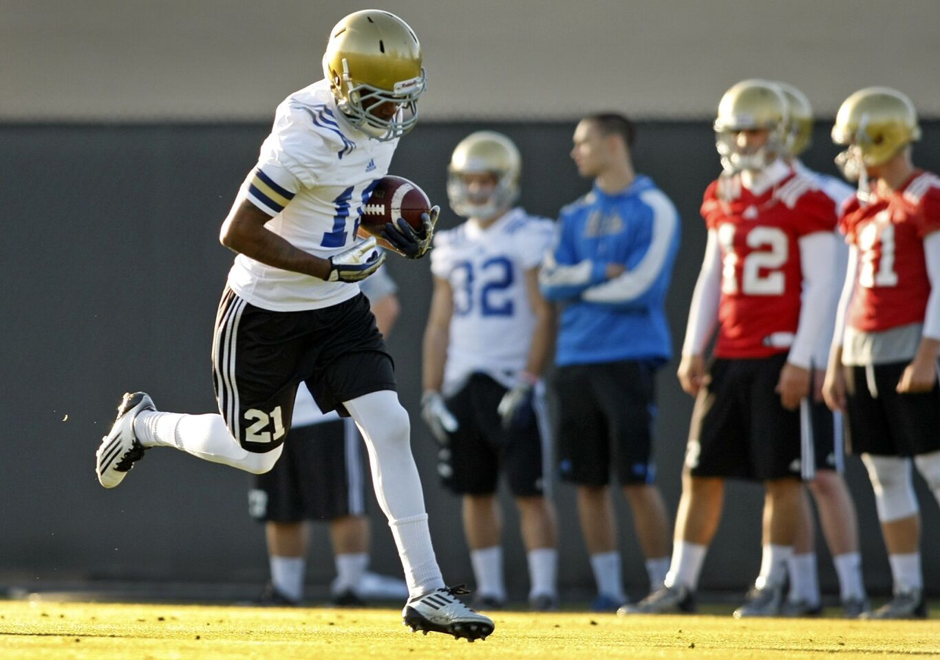 UCLA receiver Kenneth Walker catches a pass on April during the Bruins' first spring practice.