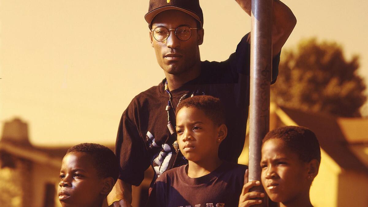 In 1991, John Singleton, center, became the youngest Academy Award nominee for best director for his debut film, "Boyz n the Hood."