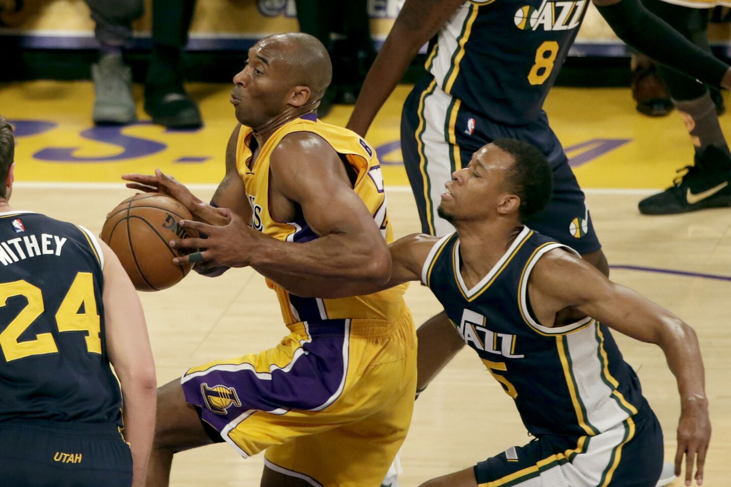 Kobe Bryant is stripped of the ball by Jazz guard Rodney Hood during first half action at Staples Center.