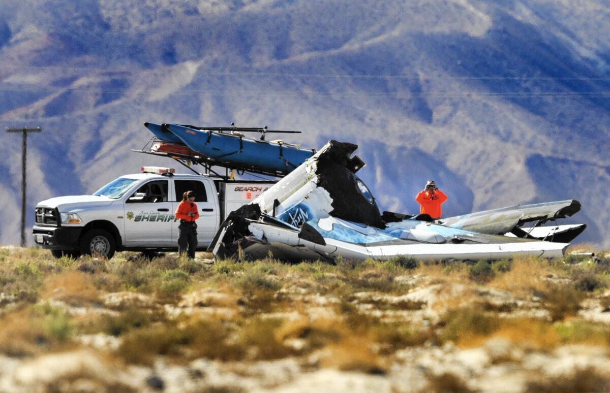 Kern County Sheriff's deputies keep watch over the wreckage of Virgin Galactic's SpaceShipTwo after it crashed in the Mojave Desert.