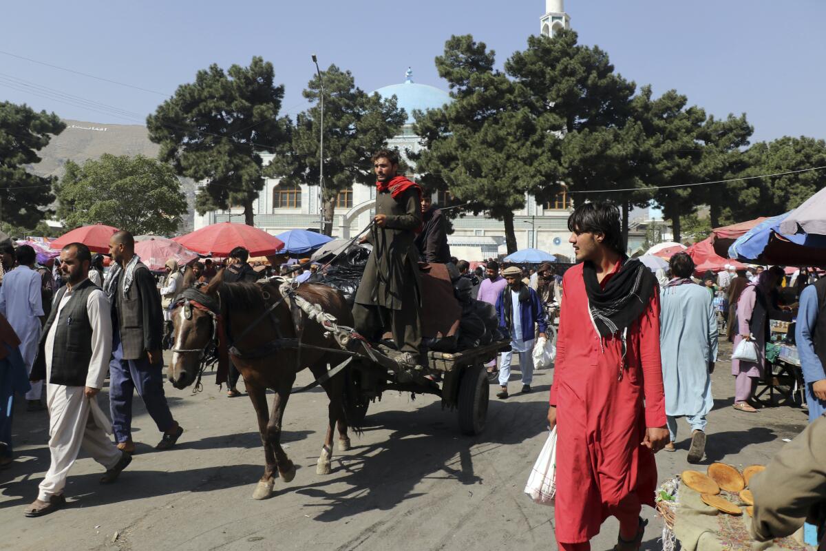 People walk on the streets in Kabul, Afghanistan, Saturday, Sept. 4, 2021. (AP Photo/Wali Sabawoon)