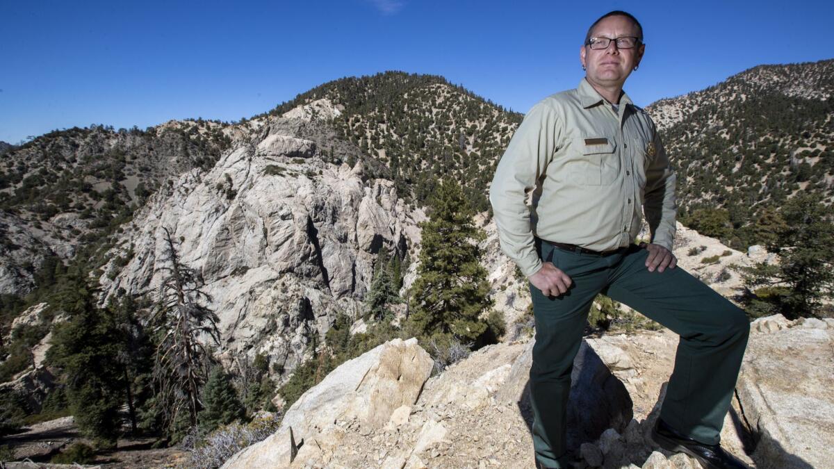 Matthew Bokach, manager of the San Gabriel Mountains National Monument, is leading a Forest Service plan to reopen climbing on the granite face of Williamson Rock, left.