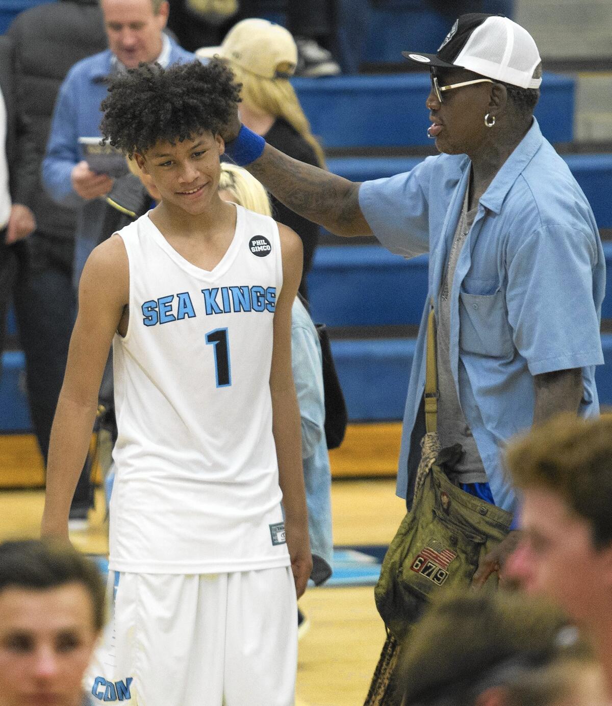 Former NBA player Dennis Rodman messes D.J. Rodman's hair after the Sea Kings defeated Shadow Hills in a CIF Southern Section Division 3A first-round playoff game on Wednesday.