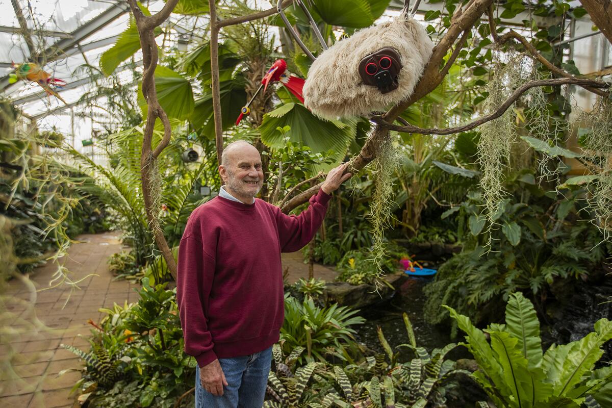 Ron Yeo shows off his exhibit "Jungle Junk Critters" at Sherman Library & Gardens in Corona del Mar.