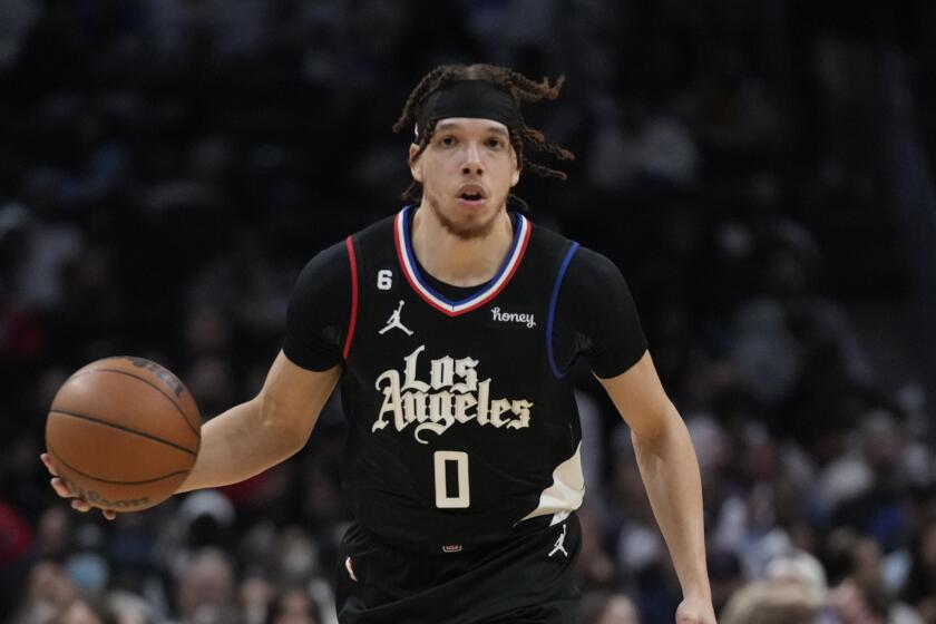 Los Angeles Clippers guard Jason Preston (0) dribbles the basketball.