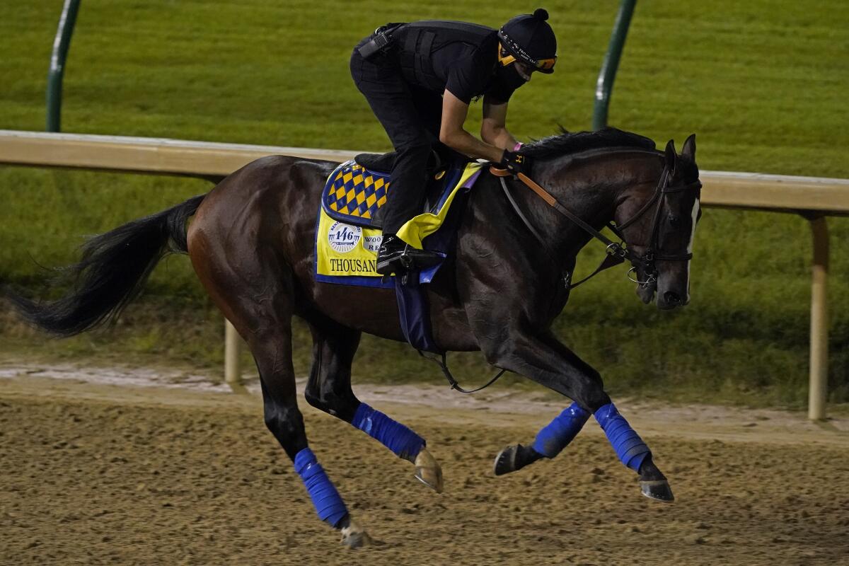 Kentucky Derby entry Thousand Words runs during an early morning workout at Churchill Downs on Friday.