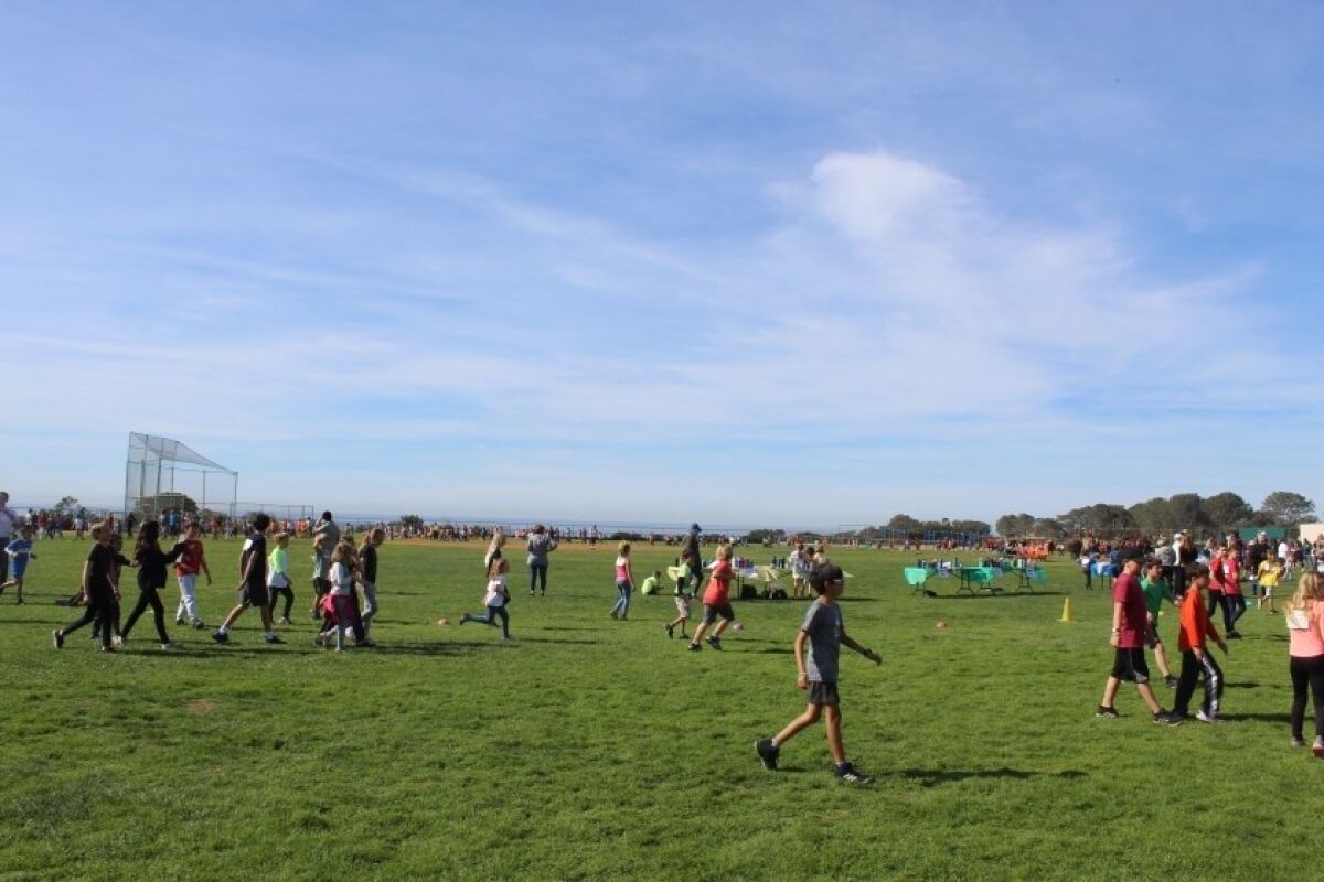 Students on the Del Mar Heights field during a jogathon held earlier this year.