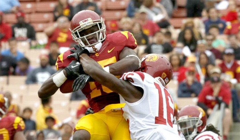 Wide receiver Nelson Angolor makes a catch at the end of USC's spring scrimmage at Los Angeles Coliseum on April 13, 2013.