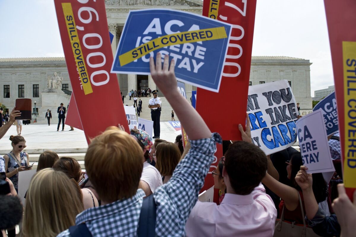 Supporters of the Affordable Care Act rallied outside the Supreme Court in June as the Court upheld a key provision of the act.