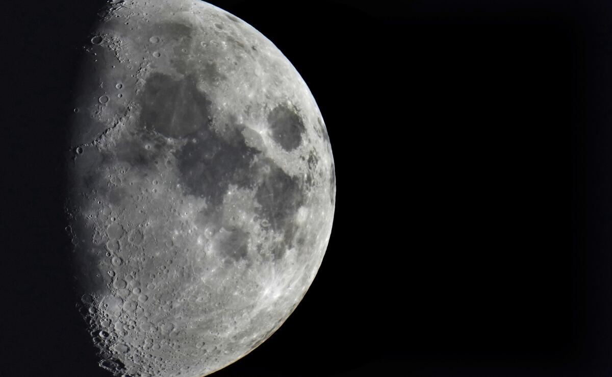 Image of the moon showing many impact craters