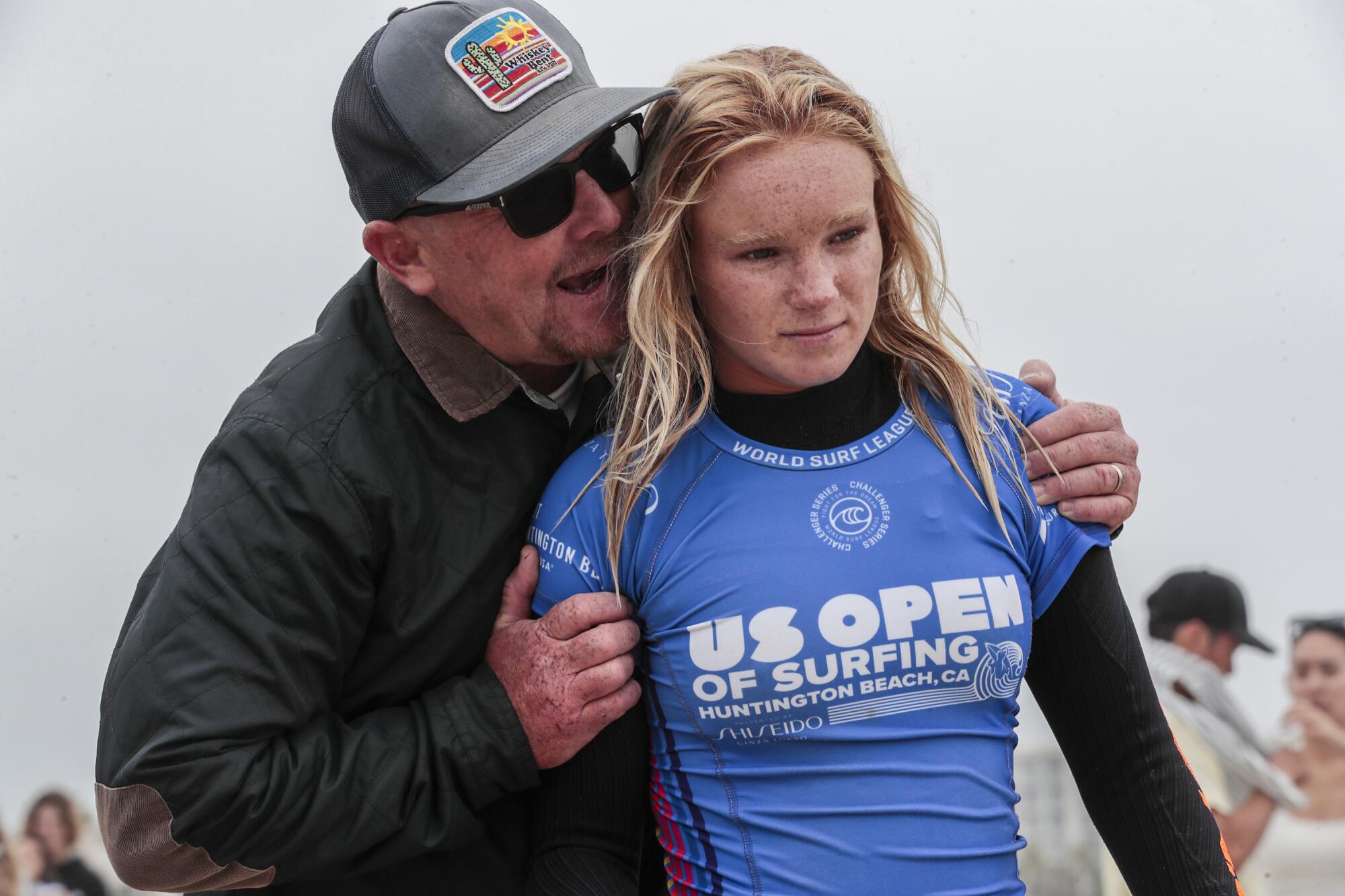 Caitlyn Simmers' father, Jessie, speaks to her moments before she surfs in the final of the U.S. Open of Surfing