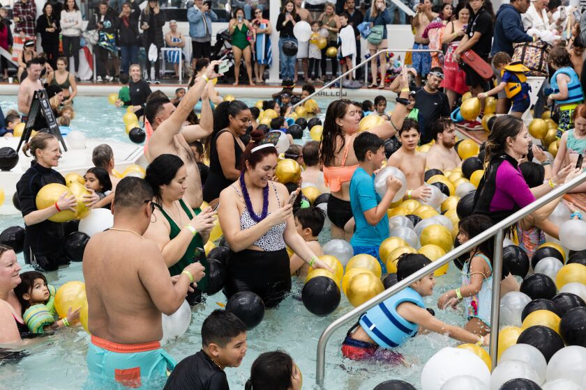 Parents and children celebrate an early New Year’s Day at the Plunge at Mission Beach on Saturday, Dec. 31, 2022.