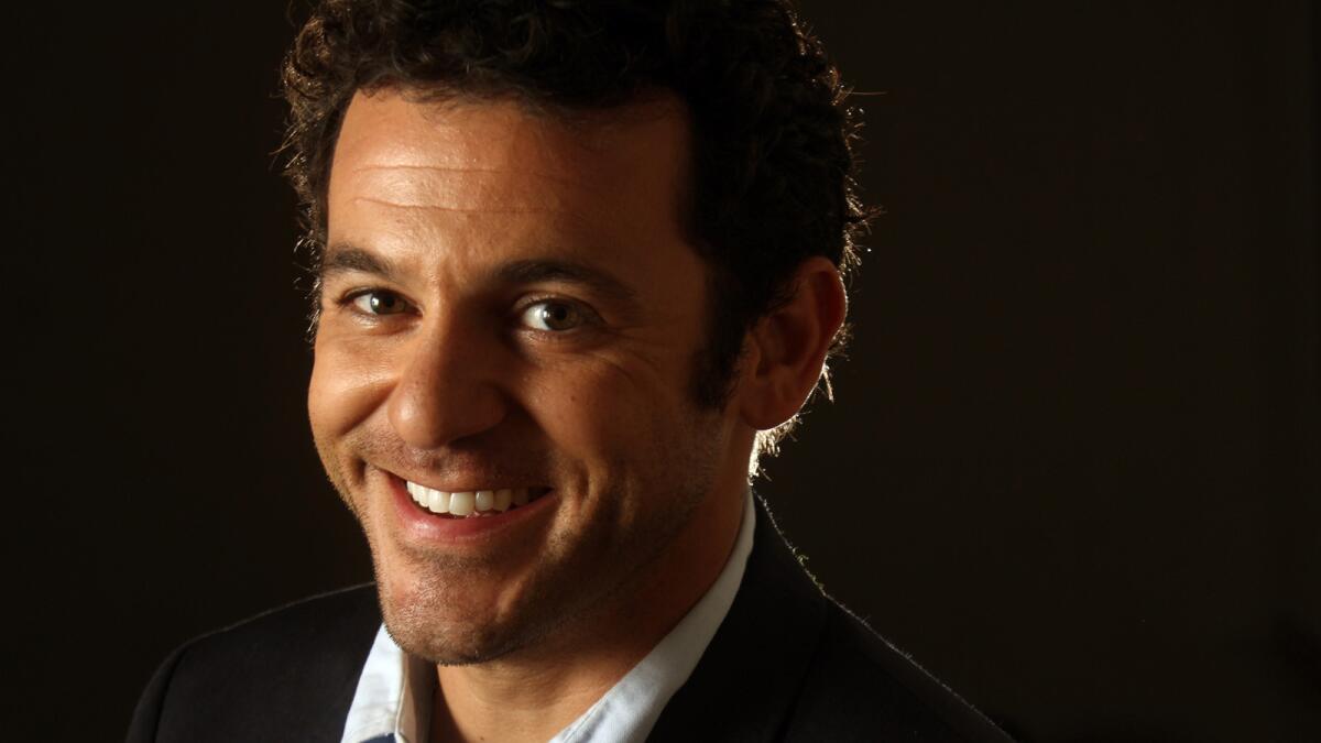 Fred Savage, who's been busy as a director, says he wasn't looking to return to acting when he was offered the Fox series "The Grinder." He stars with Rob Lowe as brothers.