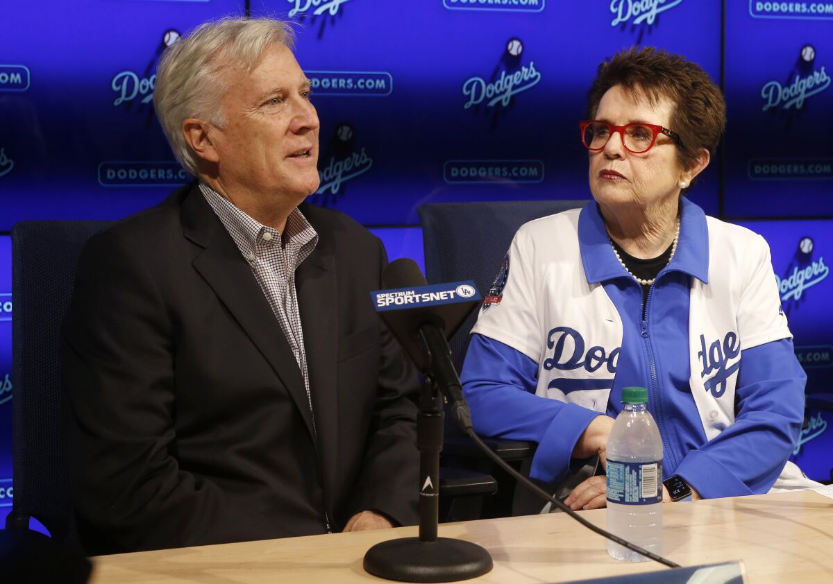 Dodgers owner and chairman Mark Walter, left, addresses media with Billie Jean King.