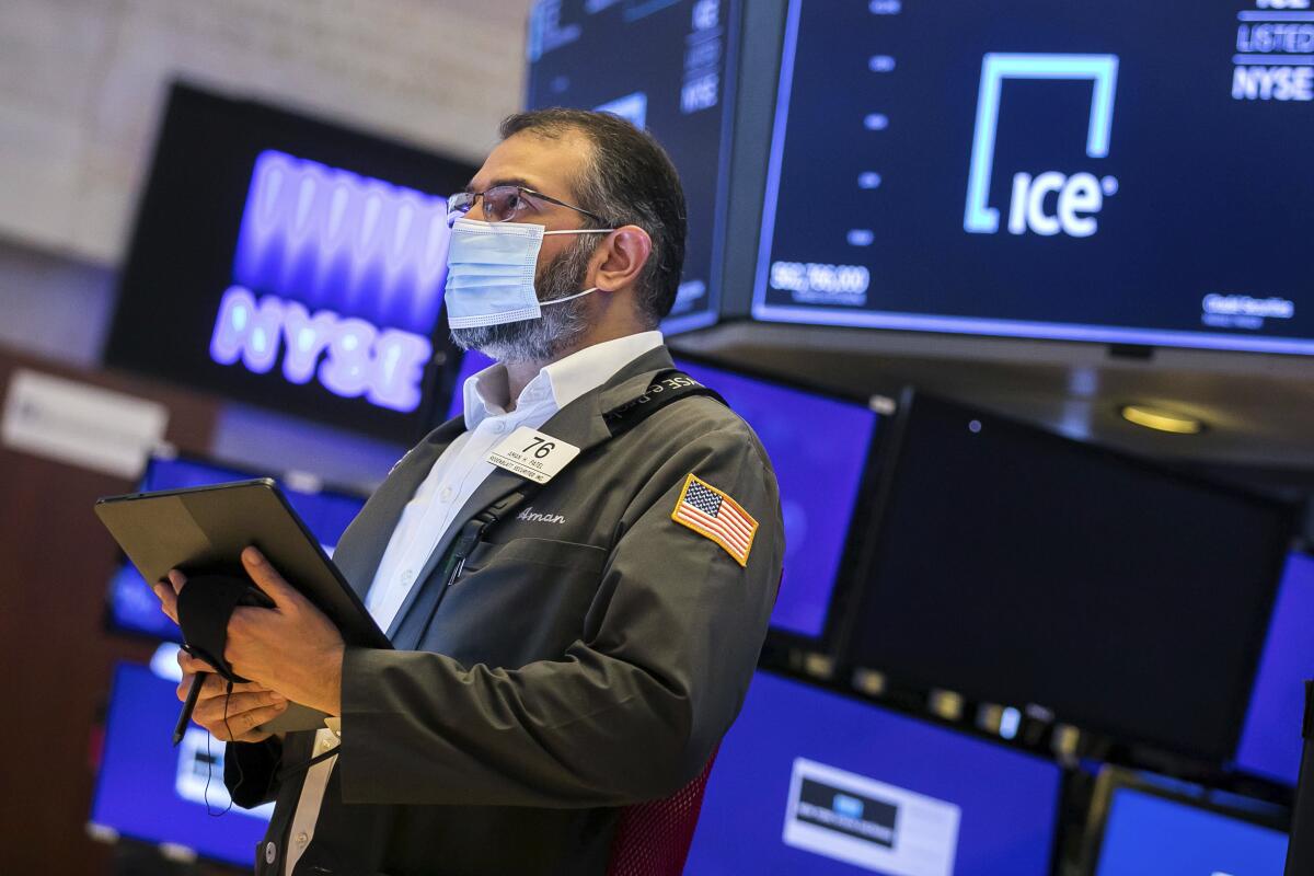 A trader works on the floor of the New York Stock Exchange. 