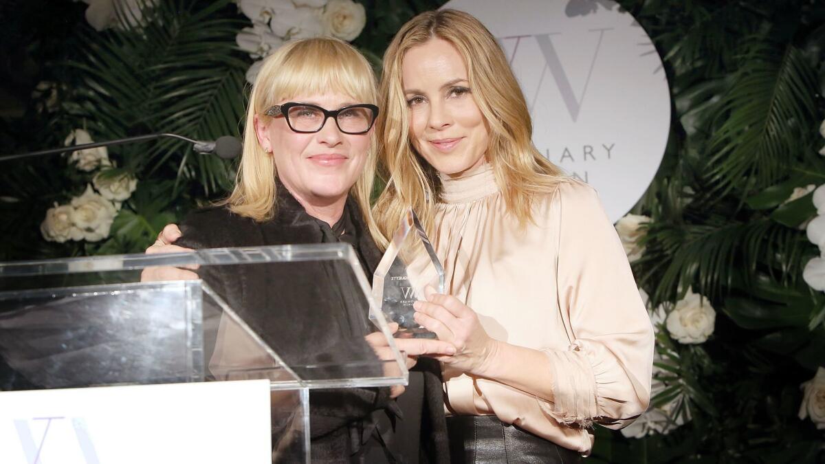 Honoree Patricia Arquette and Maria Bello onstage during Visionary Women's International Women's Day at Spago in Beverly Hills on Thursday.